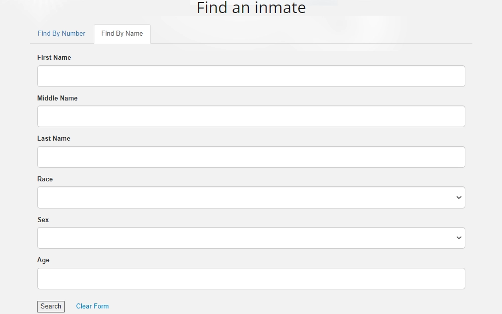 Screenshot of the find-by-name option of the inmate search tool provided by the Federal Bureau of Prisons with fields for first, middle, and last names, race, sex, and age.